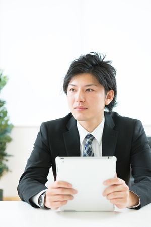 young businessman using tablet computerの写真素材