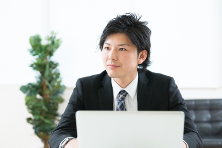 young businessman using computerの写真素材