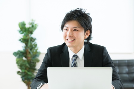 young businessman using computerの写真素材