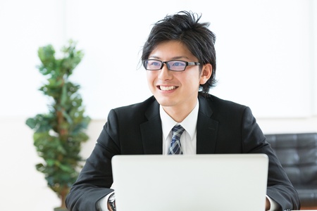 young businessman using computerの写真素材
