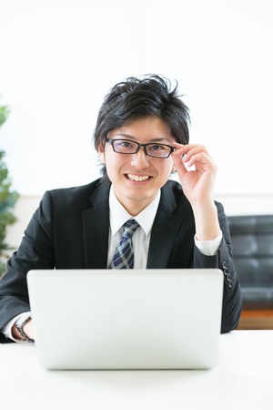 young businessman using computerの写真素材