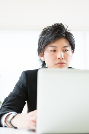 young businessman using computerの写真素材
