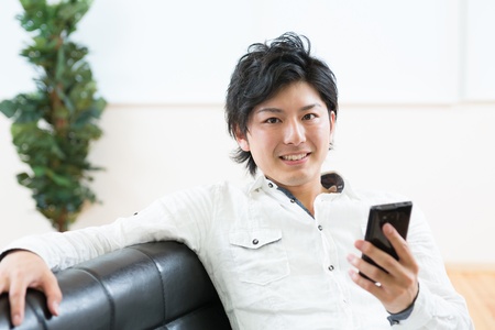 young man using smart phoneの写真素材