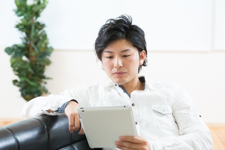young man using tablet computerの写真素材