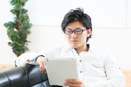 young man using tablet computerの写真素材