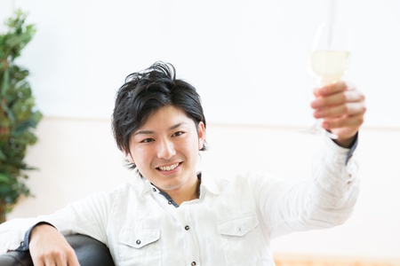 young man who drinks wineの写真素材
