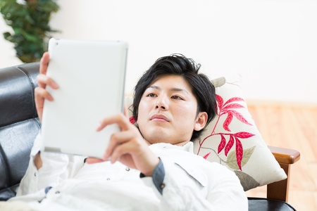 young man using tablet computerの写真素材