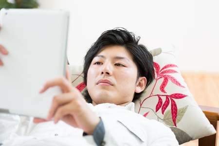 young man using tablet computerの写真素材