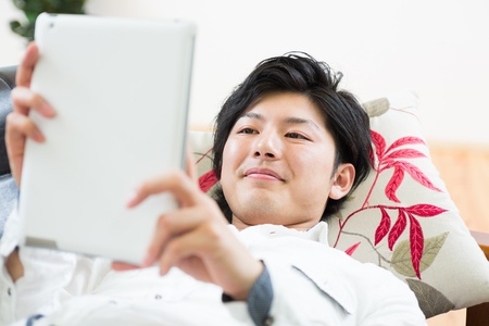 young man using tablet computerの写真素材