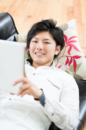 young man using tablet computerの写真素材