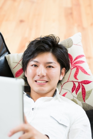 young man using tablet computerの写真素材