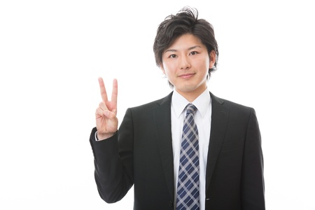 businessman indicating the number twoの写真素材