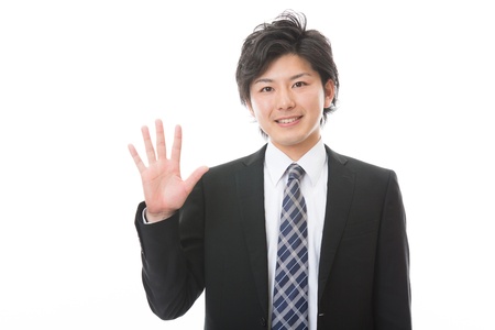 businessman indicating the number fiveの写真素材