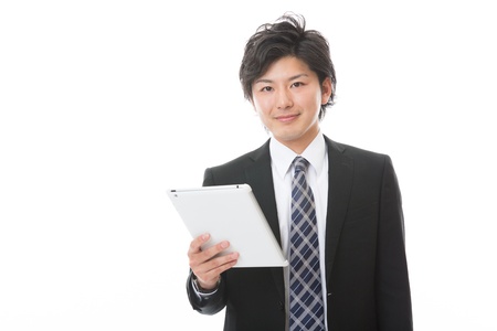 young businessman using tablet computerの写真素材
