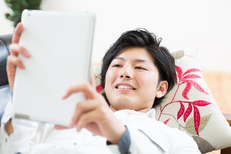 young man using tablet computerの写真素材