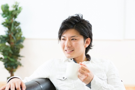 young man who takes a drinkの写真素材