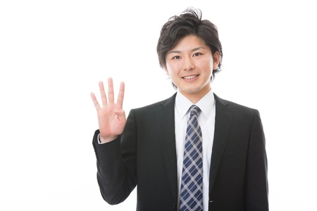businessman indicating the number fourの写真素材