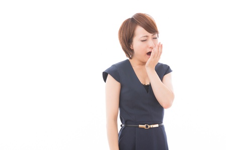 Beautiful young asian woman who yawnsの写真素材