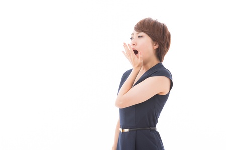 Beautiful young asian woman who yawnsの写真素材