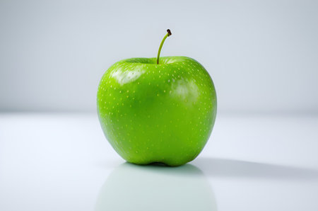 Green apple on white background. Isolated on a white background.の写真素材
