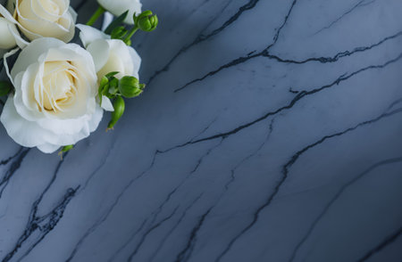 White roses on a marble background. Flat lay, top view.の写真素材