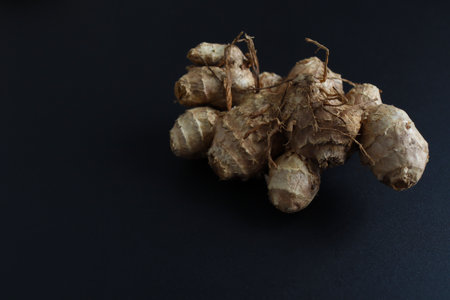 Black turmeric placed on a black background.の写真素材
