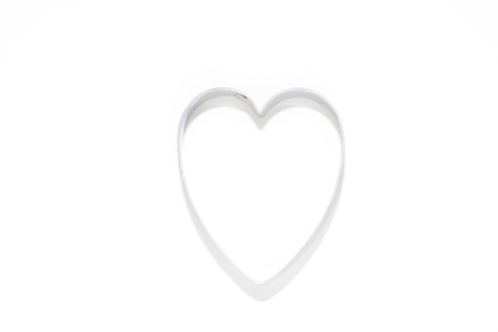 Cokkie cutter: Heart on white isolated backgroundの写真素材