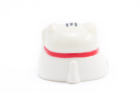 Japanese beckoning cat called Manekineko on white isolated backgroundの写真素材