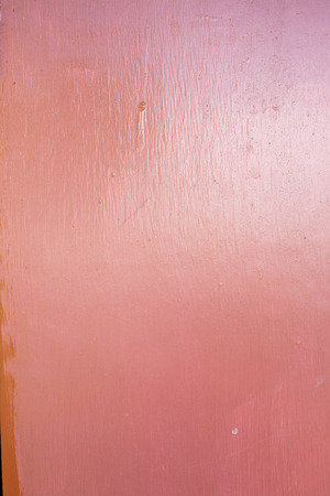 Seamless picture of the rough panted red wooden boardの写真素材