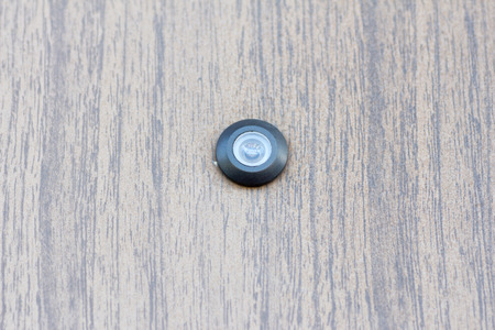 A spy hole on the wooden entrance door