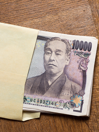 Japanese 10000 yen bill in the envelopeの写真素材