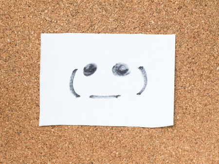 The series of Japanese emoticons called Kaomoji on the cork board, blankの写真素材