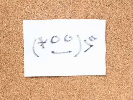 The series of Japanese emoticons called Kaomoji on the cork board, embarrassedの写真素材