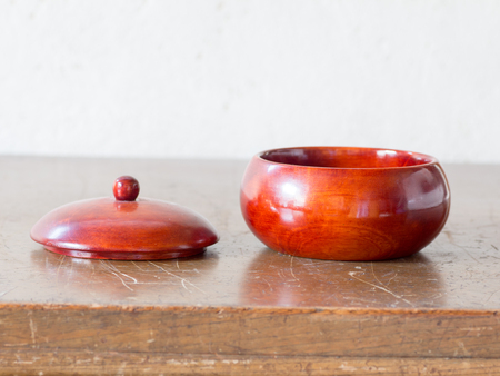 Asian antiwue wooden container on the antique wooden tableの写真素材