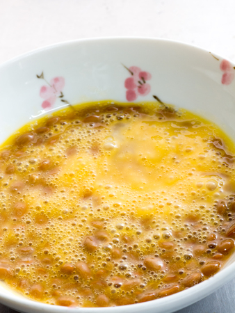 Japanese cuisine, fermented soybeans called Natto with a raw eggの写真素材