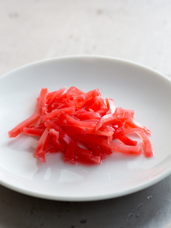 Japanese cuisine, red pickled ginger on dishの写真素材