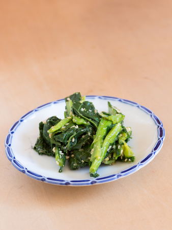 Japanese cuisine, homemade steamed green vegetable with sesame sauceの写真素材
