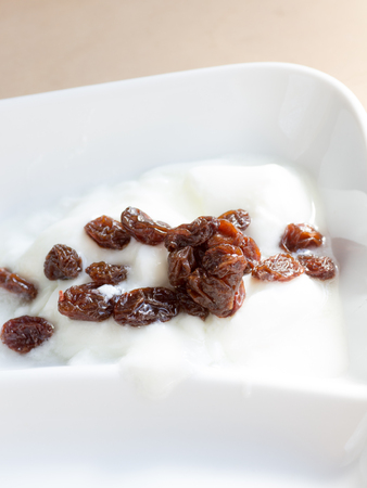 Simple homemade yogurt and raisinsの写真素材