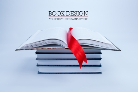 open book on a pile of books isolatedの写真素材