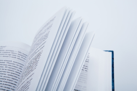 Pages of the book macro on white backgroundの写真素材