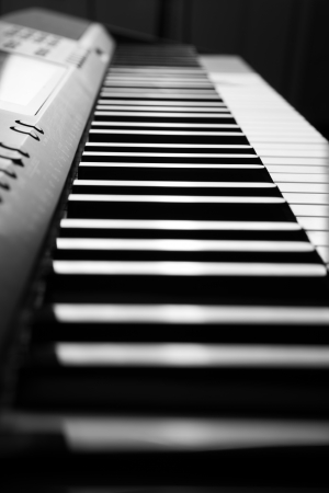 black and white keys of the piano close-upの写真素材