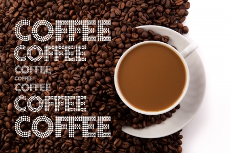 cup of coffee with milk and roasted coffe beans on a white backgroundの写真素材