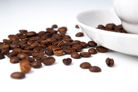 cup of black coffee and roasted coffe beans close-upの写真素材