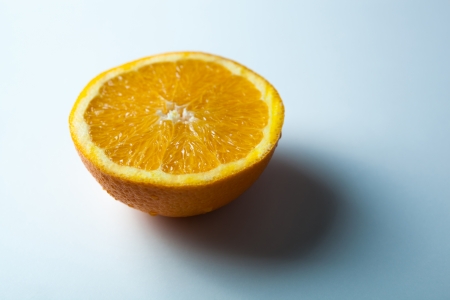 slice of orange with shadow close-up