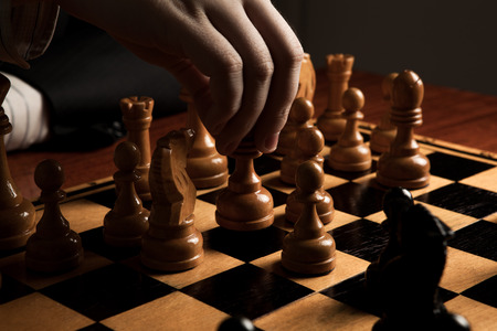 hand of man making a move chess figureの写真素材