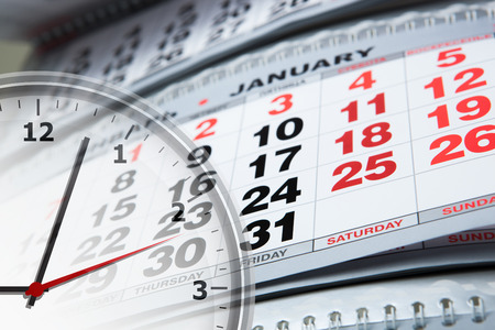 large wall calendar and clock close-upの写真素材