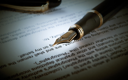 fountain pen on text sheet paper close-upの写真素材