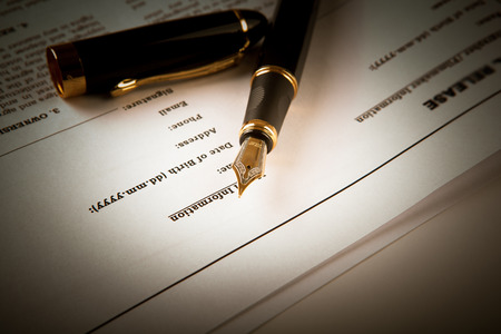 fountain pen on text sheet paper contract close-up
