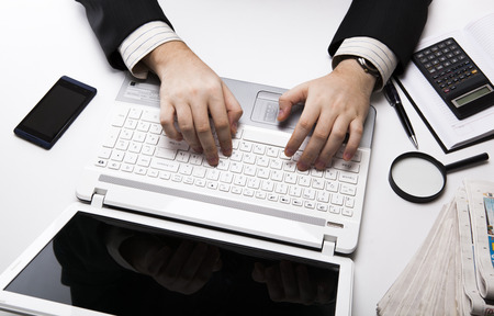 human fingers on the notebook keyboard close-upの写真素材