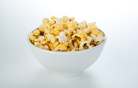 dish with popcorn a white backgroundの写真素材